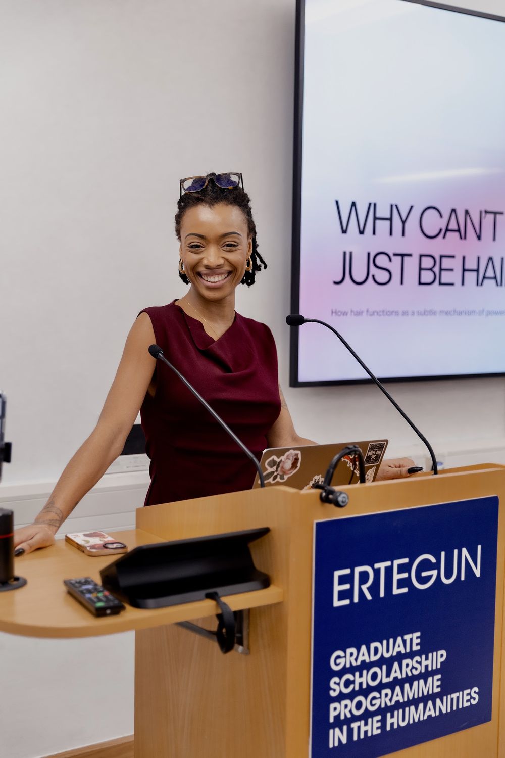 Paige at a lectern at the Ertegun Graduate Scholarship Programme