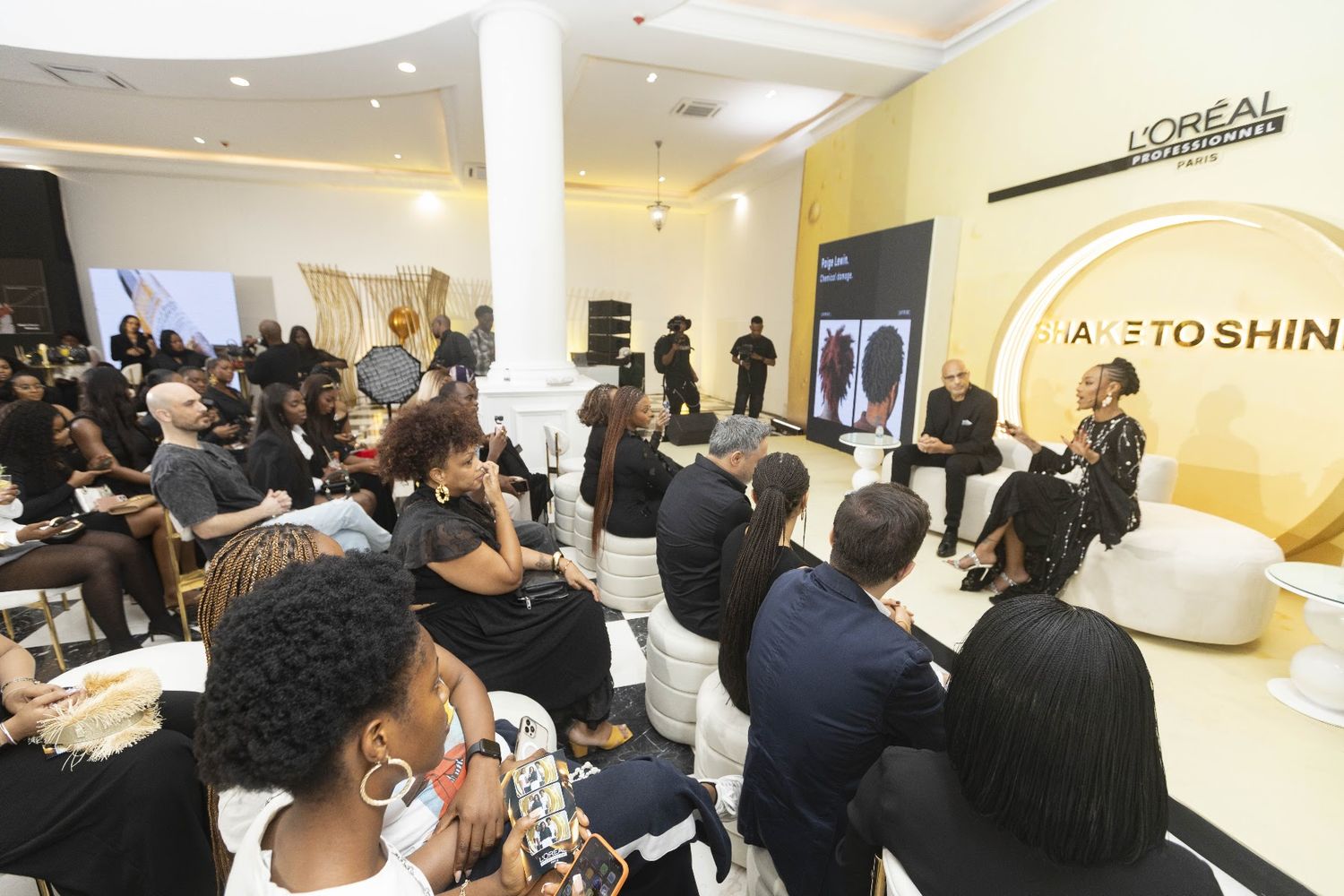 A packed room watching Paige at the L'Oréal launch